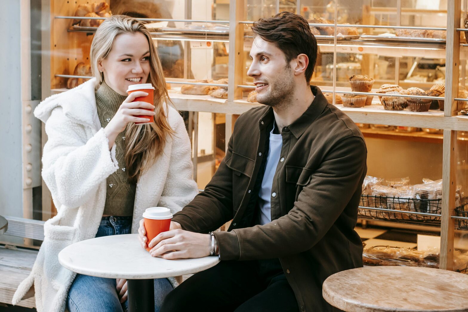 Introverted woman enjoying a calm coffee shop date — exclusive dating tips from Miss Date Doctor