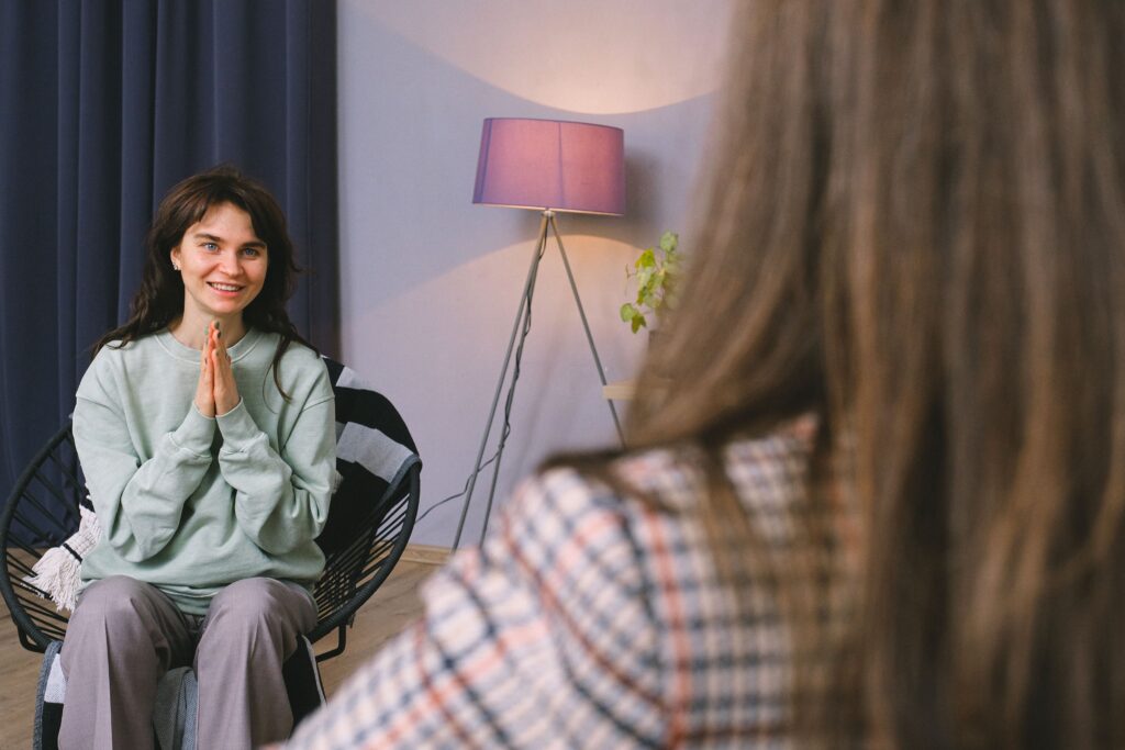 Relationship coach helping an individual discuss relationship problems and emotional concerns.